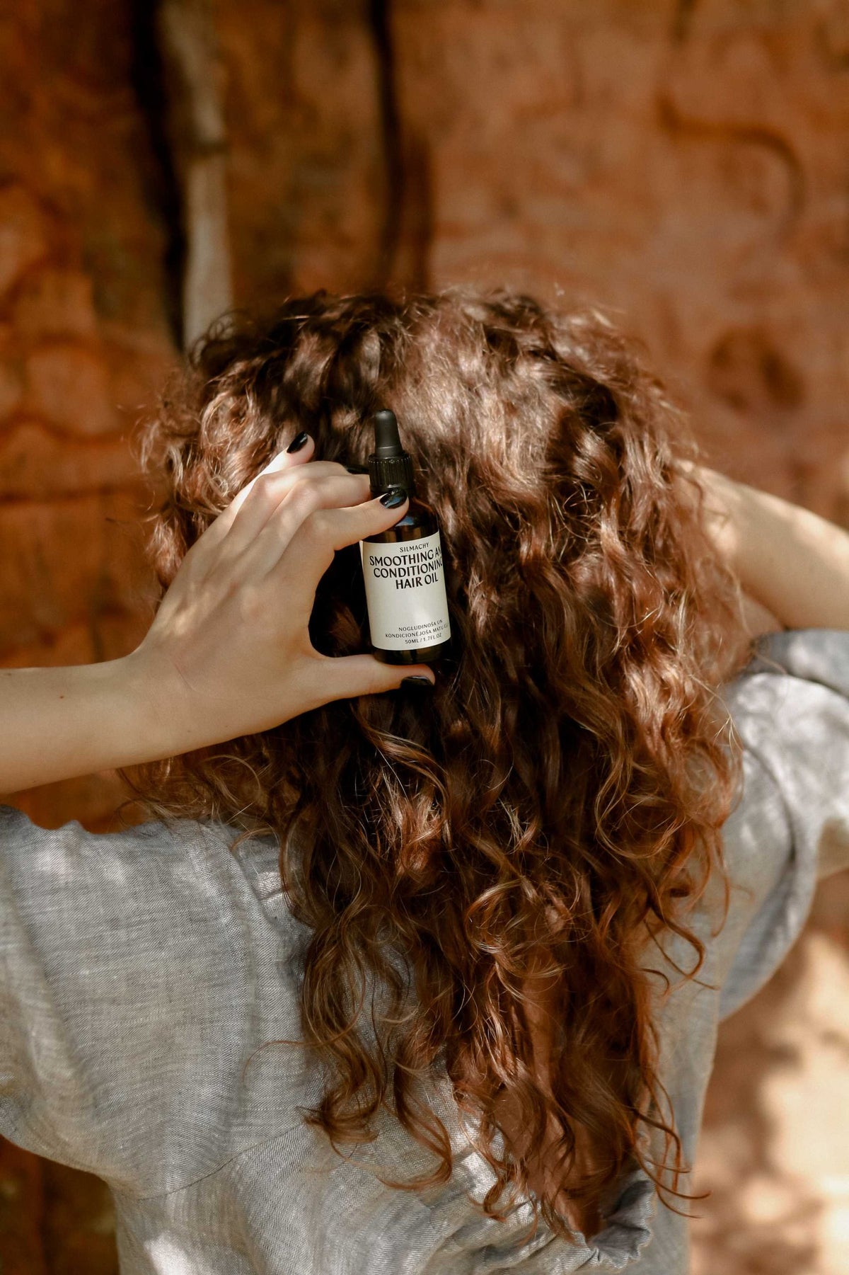 Smoothing and conditioning hair oil SILMACHY